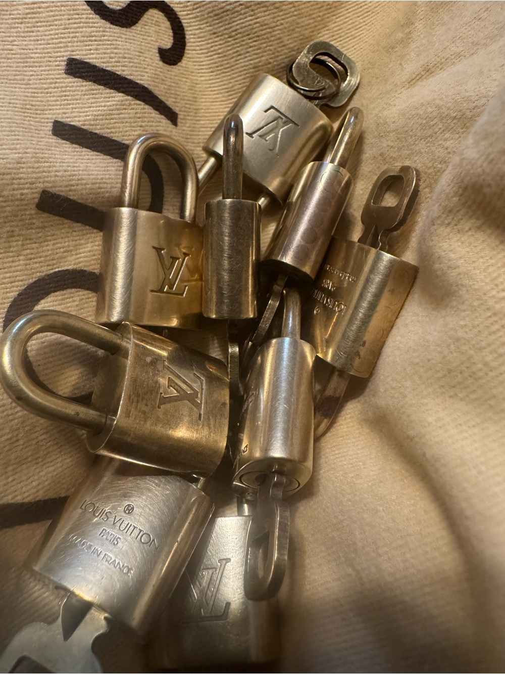 Louis Vuitton Gold-Tone Padlock and Key Lot